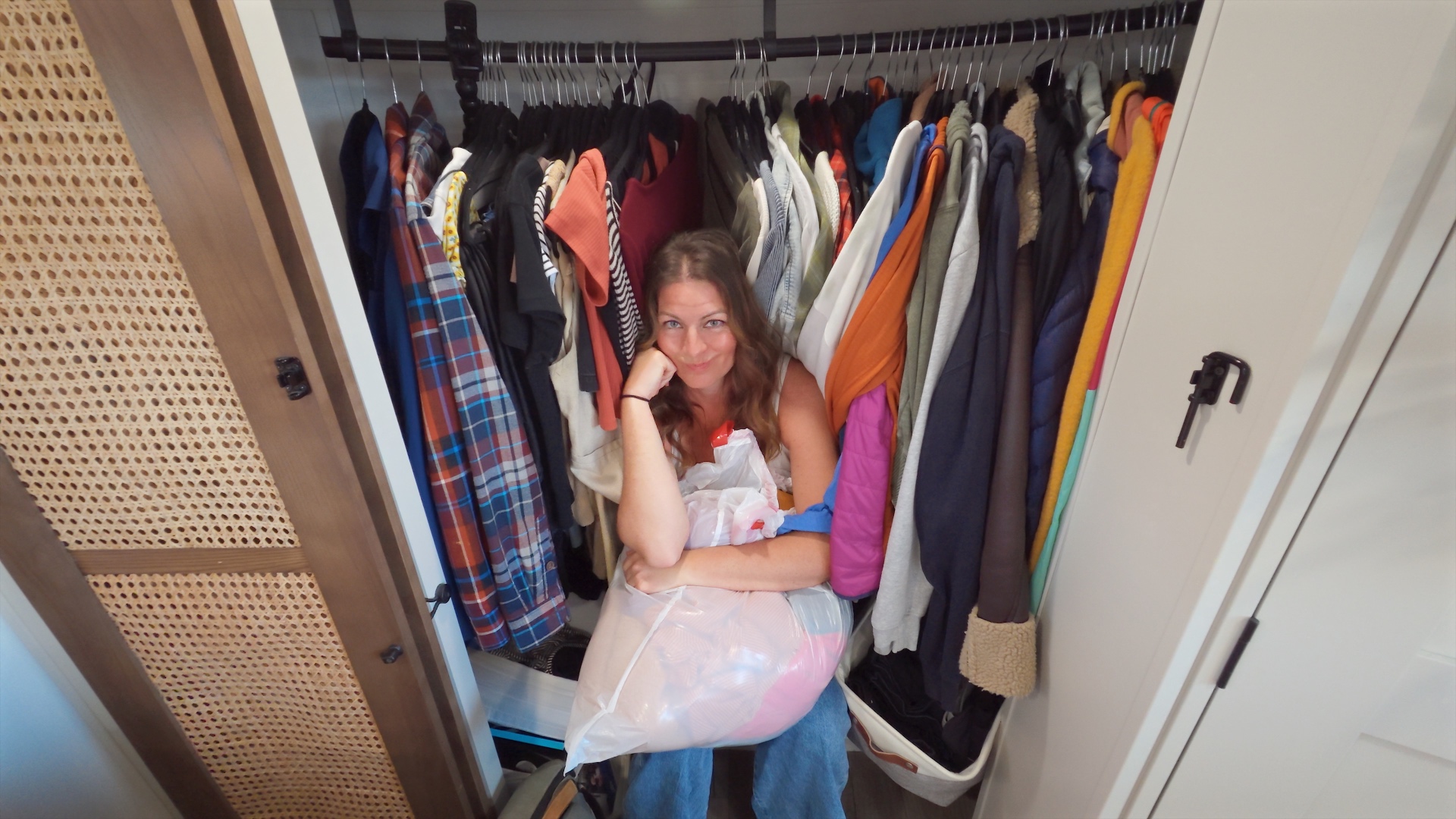 Closet stuffed full of clothes